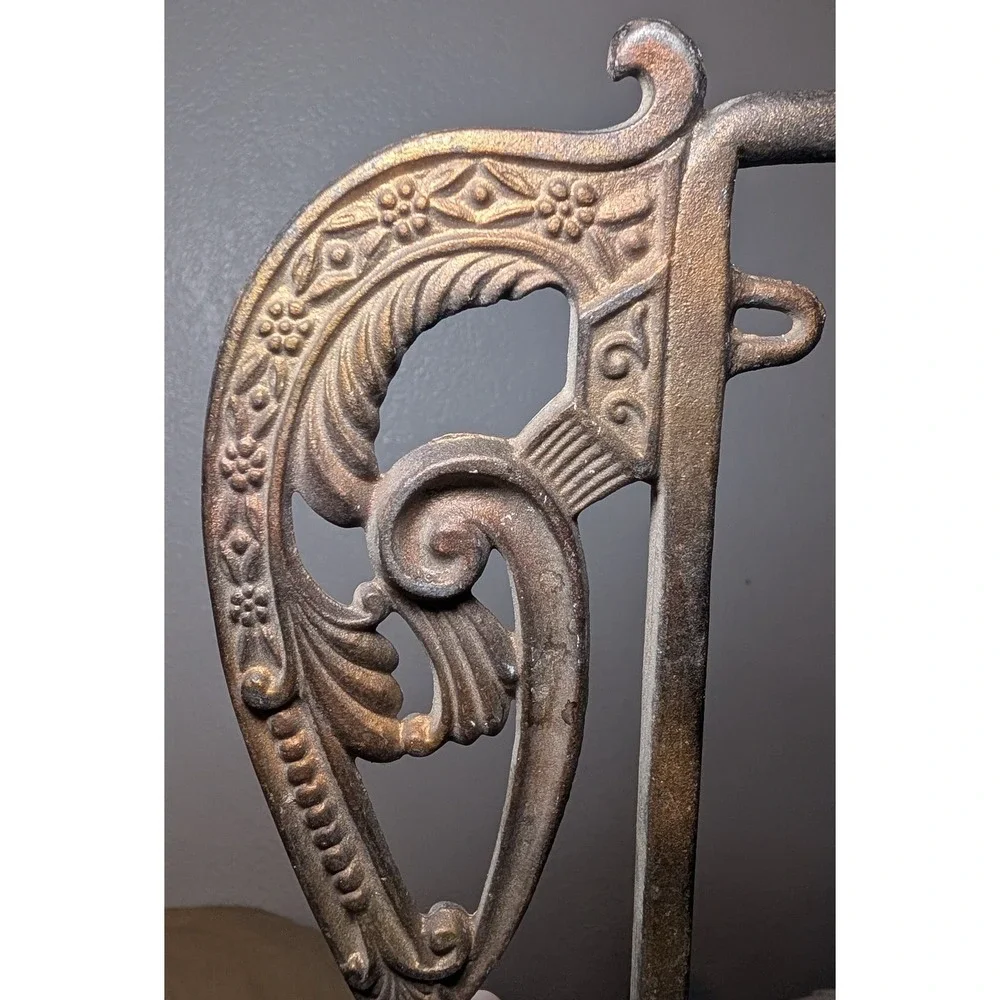 Victorian-style feather scroll curtain holder rod cool vintage metal decor piece